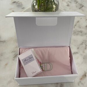 Dior pink clutch makeup pouch with Miss Dior perfume